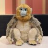 Peluche singe doré réaliste assis