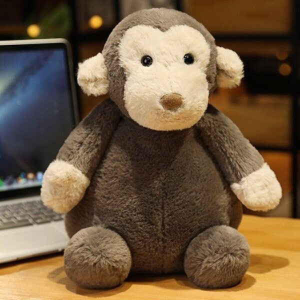 40edf26c-2ac5-49b2-862f-7be6c33a793a_de3dd52f-32c8-4378-aa4c-0e262e381873.jpg Peluche singe mignon et câlin