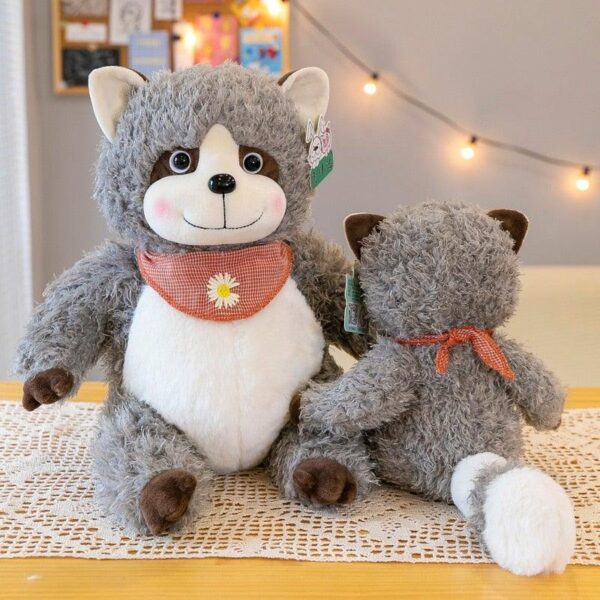 4ce26aa1-96bb-4d1f-941d-e9c0de5b304d_bc2211ec-3969-49b2-aa13-e9864d38b787.jpg Oreiller en peluche raton laveur gris