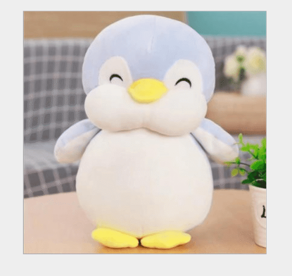 Poupée en peluche pingouin heureux et potelé