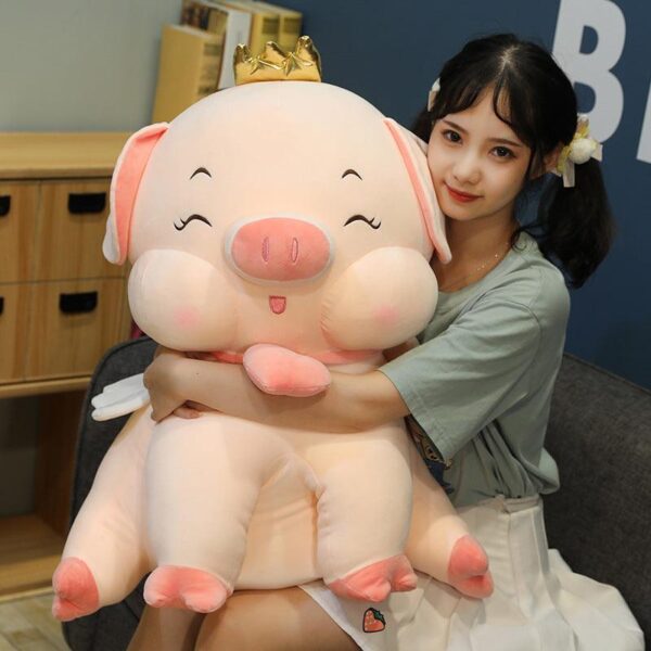 f47c24a244dd11c1326383e02554b24a_f3567b00-4729-4a2f-950f-349eb28f6577.jpg Poupée en peluche Angel Pig