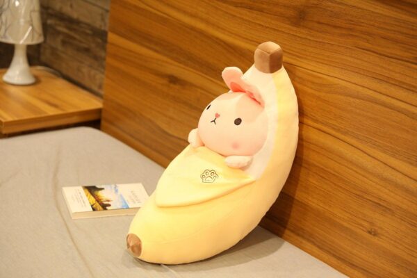Jouet peluche créatif en forme de cochon qui pèle les bananes