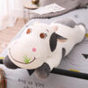 Vache géante en peluche aux grands yeux