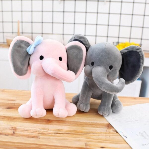 product-image-1528630784_b011f8aa-97e1-4343-9fda-4ca4868d293e.jpg Peluche éléphant endormi de 9" pour la chambre de bébé