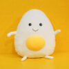 Peluche géante souriante en forme de crane d’œuf
