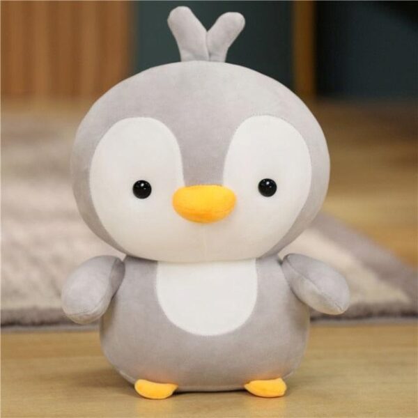 Adorable couple de pingouins en peluche