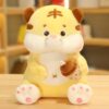 Animaux en peluche tigre assis avec du thé au lait