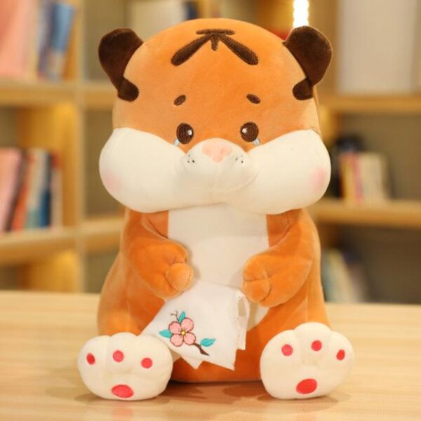 Animaux en peluche tigre assis avec du thé au lait