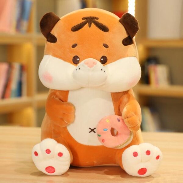 Animaux en peluche tigre assis avec du thé au lait
