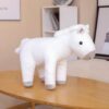 Poupées en peluche cheval assis