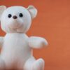 photo by karen laårk boshoff A cute plush teddy bear with a warm expression, perfect for children's decor or gift ideas.